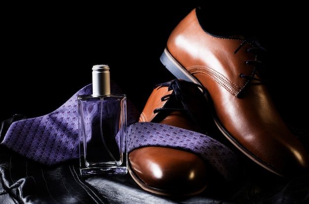 man's style. shoes with tie and perfume