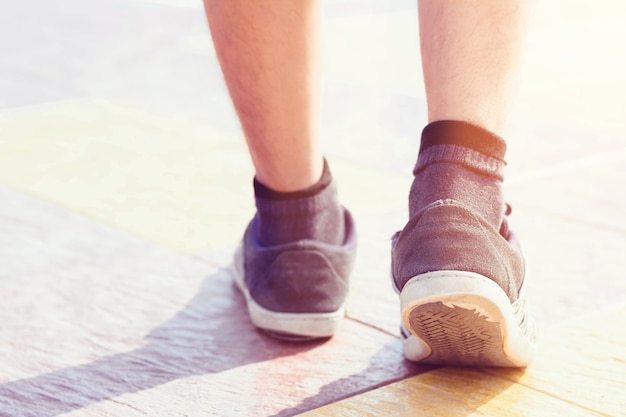 Man's walking and close up of shoes