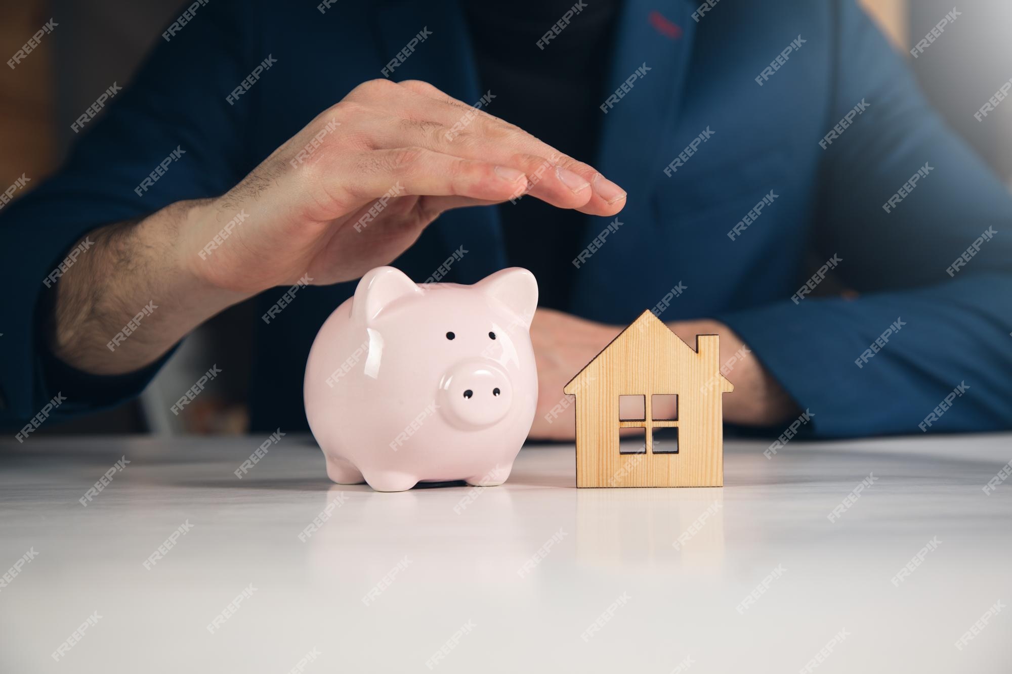 Premium Photo | Man saving money for buying house financial plan home loan  concept