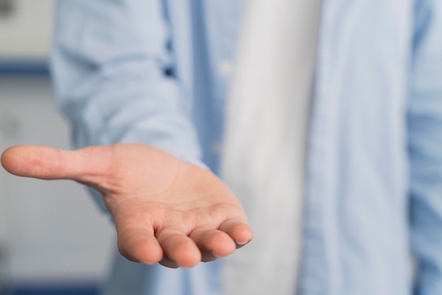 Man scientist showing his palm