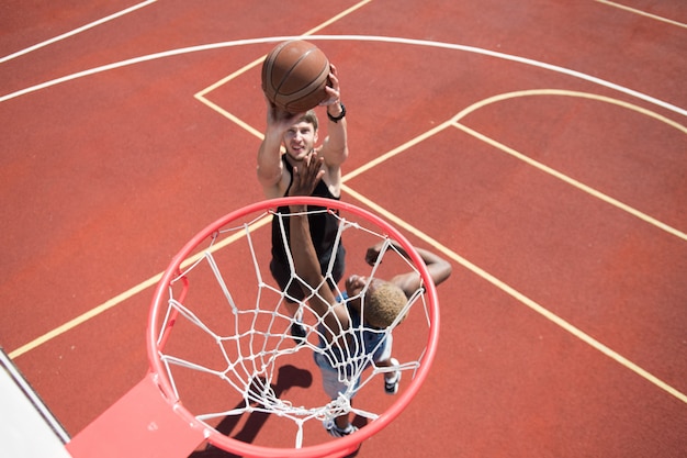 Man scoring a basket