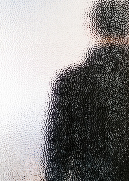 Photo man seen through window