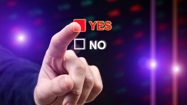 Man selects answer YES on digital display with finger as a choice concept