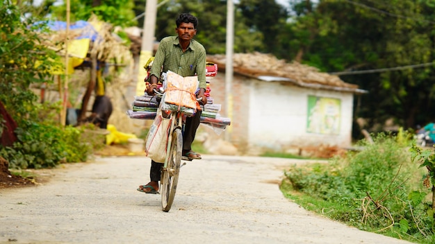 Man selling some items from cycle