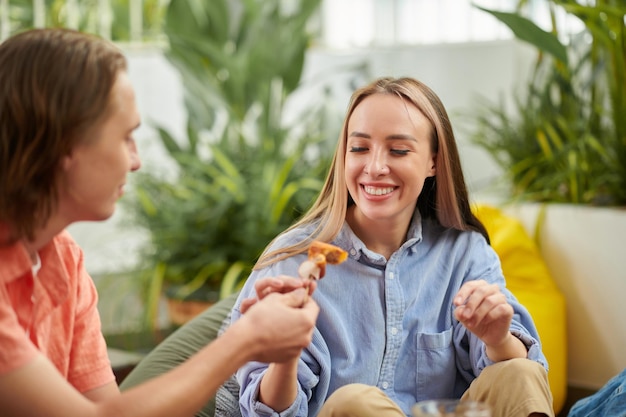 Man Sharing Snack with Girlfriend