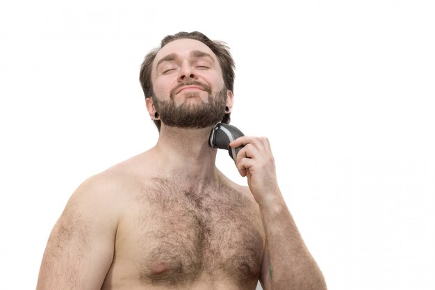 A man shaves himself against a white background