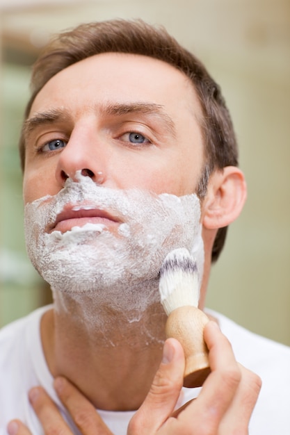 Man shaving in the bathroom