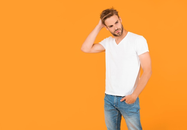 man in shirt on yellow background with copy space fashion