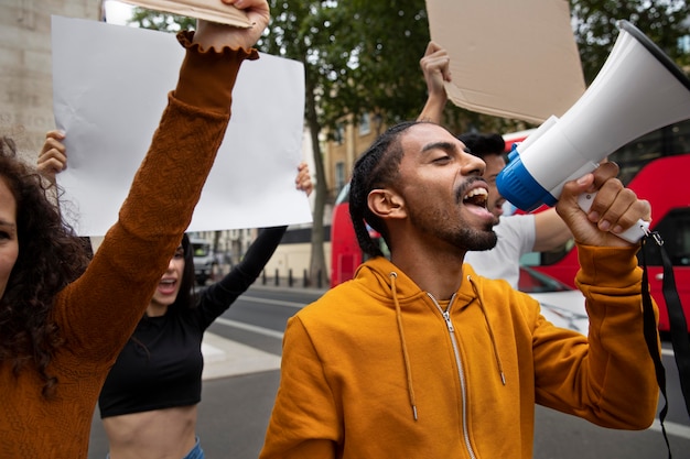 Photo man shouting into a megaphone close up