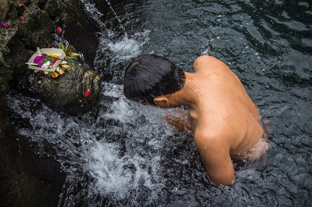 A man shower  holy water in Baly