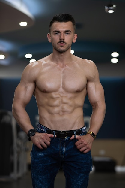 Man Showing Abdominal Muscle In Jeans