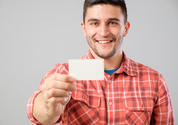 Man showing blank business card