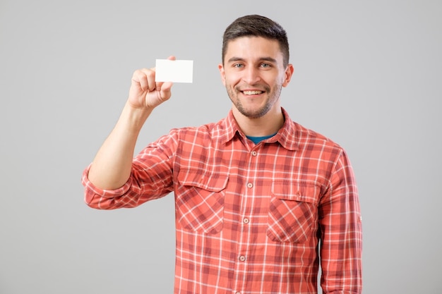 Man showing blank business card