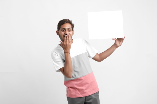 man showing blank signboard