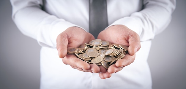 Man showing coins. Business. Finance