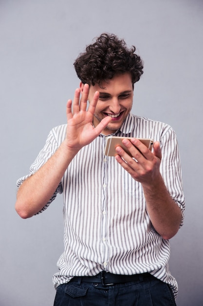 Man showing greeting gesture on web camera