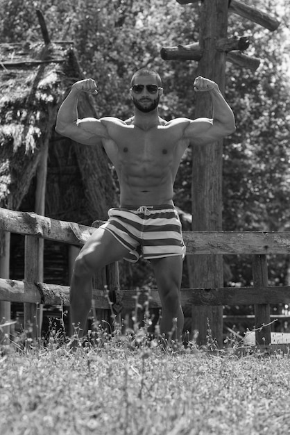 Man Showing His Well Trained Body Outdoors