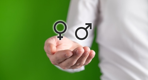 Man showing male and female gender symbols
