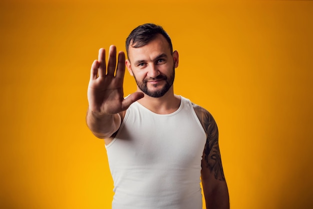 Photo man showing stop gesture people and emotion concept