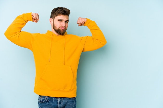 man showing strength gesture with arms