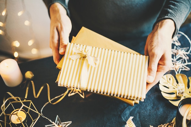 Man showing wrapped gifts