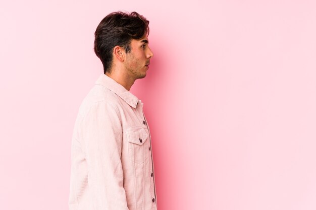 Man sideways posing in studio