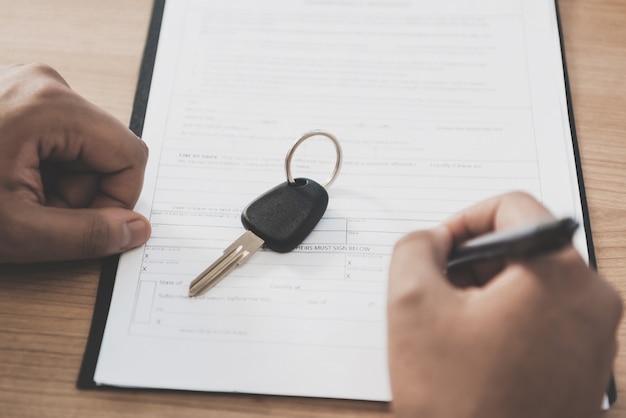 man signing a contract