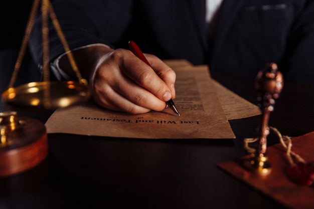 Man signing a Last Will and Testament document