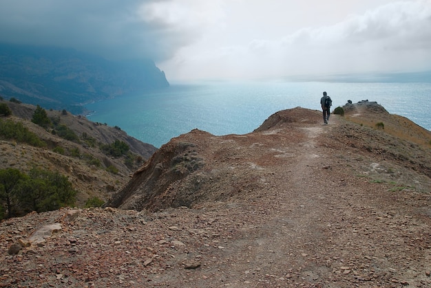 Man silhouette on a sea cliff