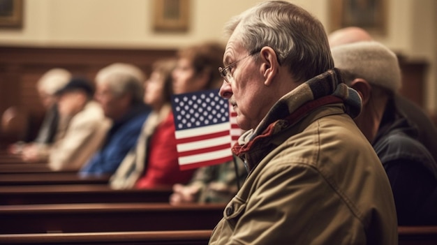 A man sits in a church with an american flag in the background.