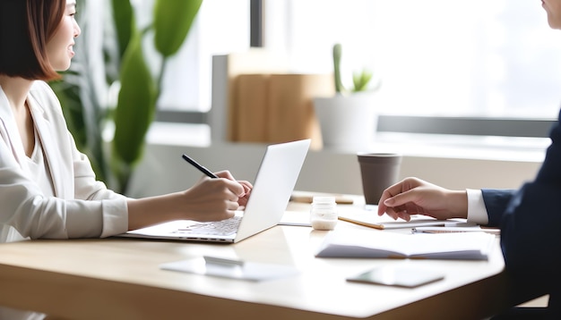 a man sits at a desk with a laptop and a cup of coffee