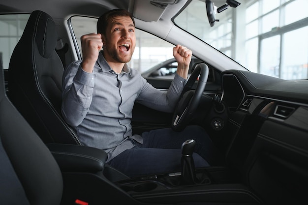 Man sits in his lovely car