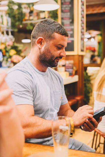 Man sitting in a bar having a good time.