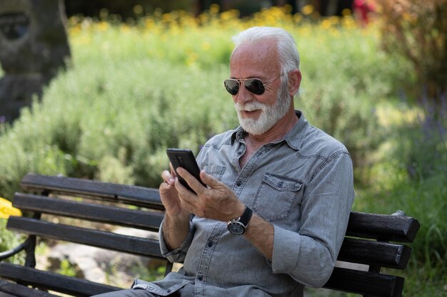 Man sitting on bench in park