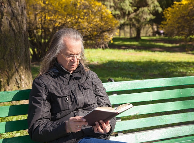 man sitting on bench in park