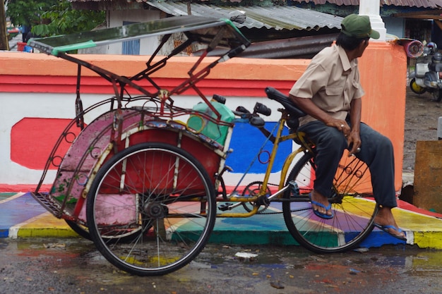 Man sitting on bicycle in city