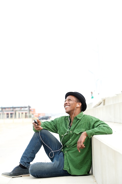 Man sitting outdoors with cellphone