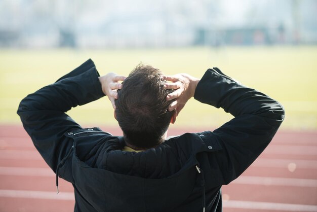 Man Sitting on the Seat and Cheering