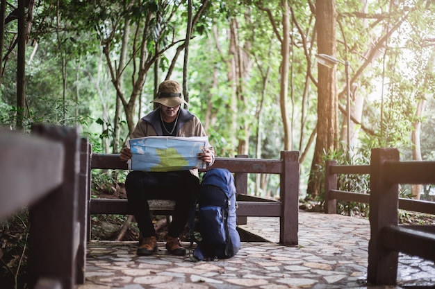 Man sitting on seat in park
