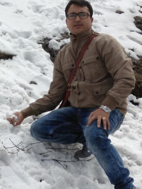 Man sitting on snow