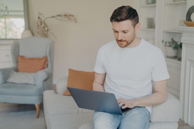 Man sitting on sofa at home