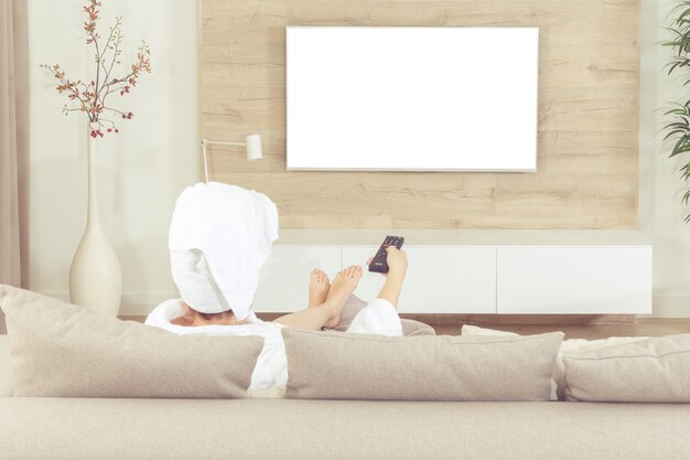 Photo man sitting on sofa at home