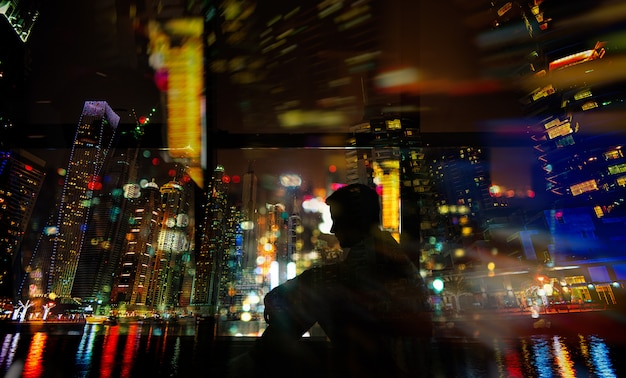 Man sitting next to window.