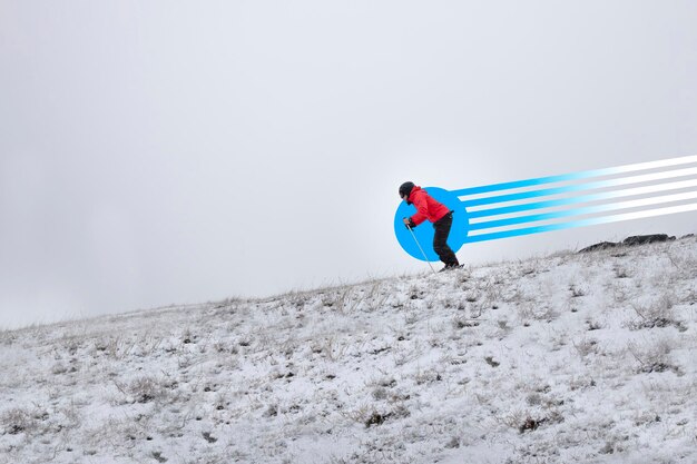 A man skiing downhill on a mountain slope