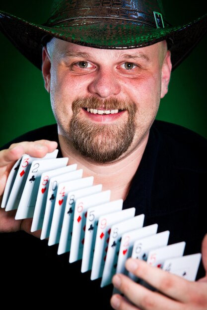 man skilfully shuffles playing cards...