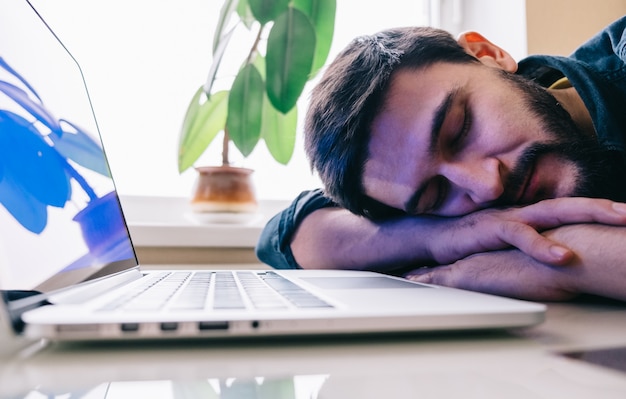 Man sleeping with his laptop