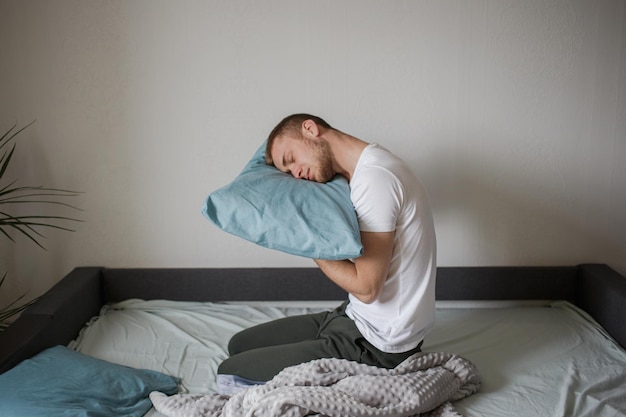 A man sleeps funny in bed