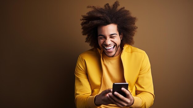 Photo man smiling and looking at his smartphone which he holds in his hands