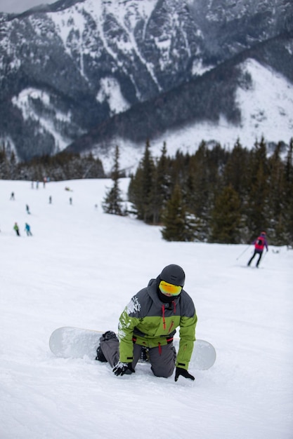 Man snowboarder portrait on ski slope