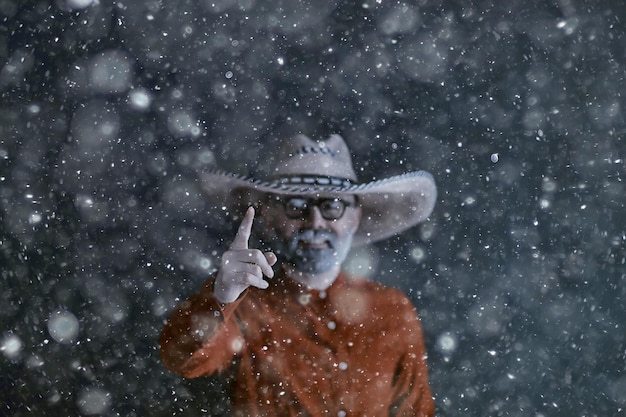 man in sombrero hat with brim, mexican style, latin america, snow cold winter christmas background